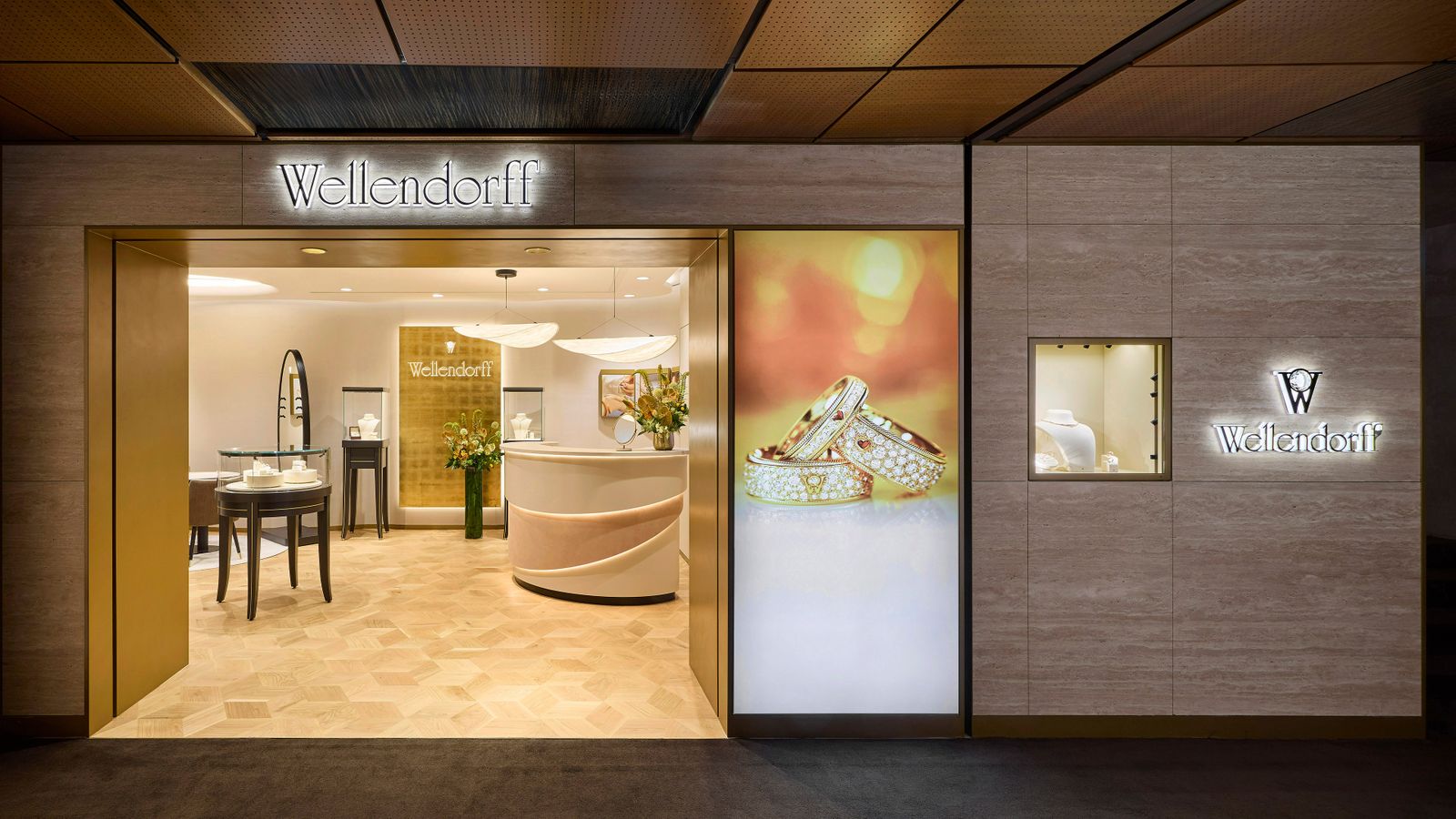 Eingang der neuen Wellendorff Boutique in der Galleria East in Seoul – modernes Design mit goldenen Akzenten und leuchtendem Logo.